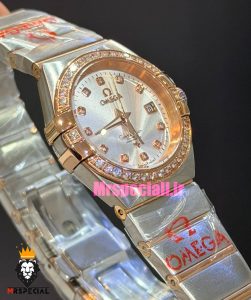 ساعت امگا زنانه مدل کانسلیشن دورنگ رزگلد قاب نگین صفحه نقره ای OMEGA CONSTELLATION 021597